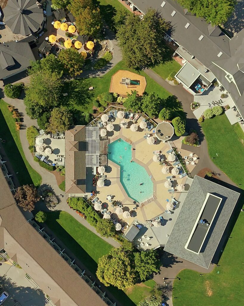 A birds eye image of Balcomo Penticton, featuring the hotel's pool, courtyard and wellness spaces