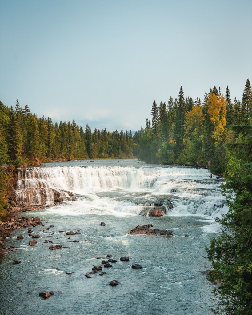 Dawson Falls in Wells Gray Provincial Park British Columbia, peacefully stretches across the blue river