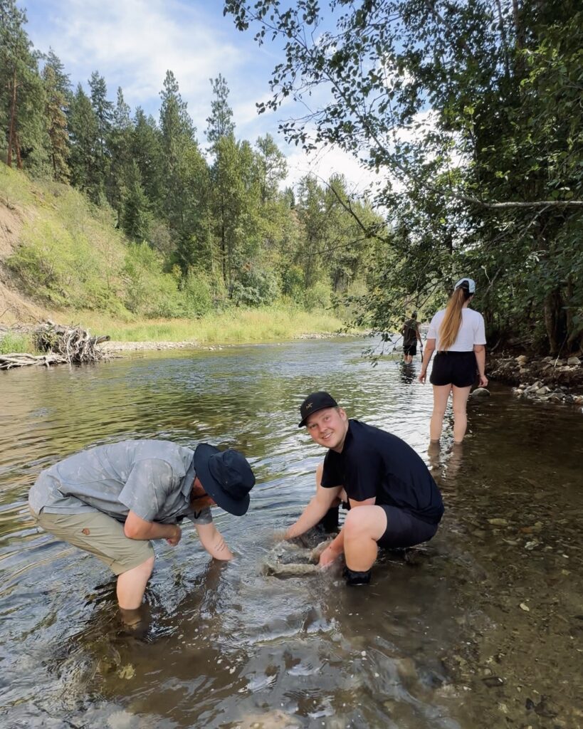 Gold panning in Mission Creek, Kelowna, British Columbia on an E-Bike Tour 
