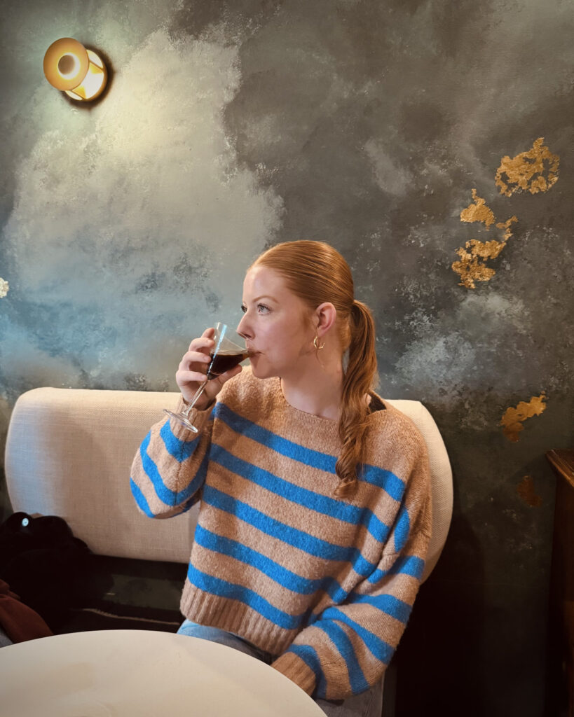 A girl sips on an espresso martini inside Chulo Tapas Bar in Penticton, British Columbia