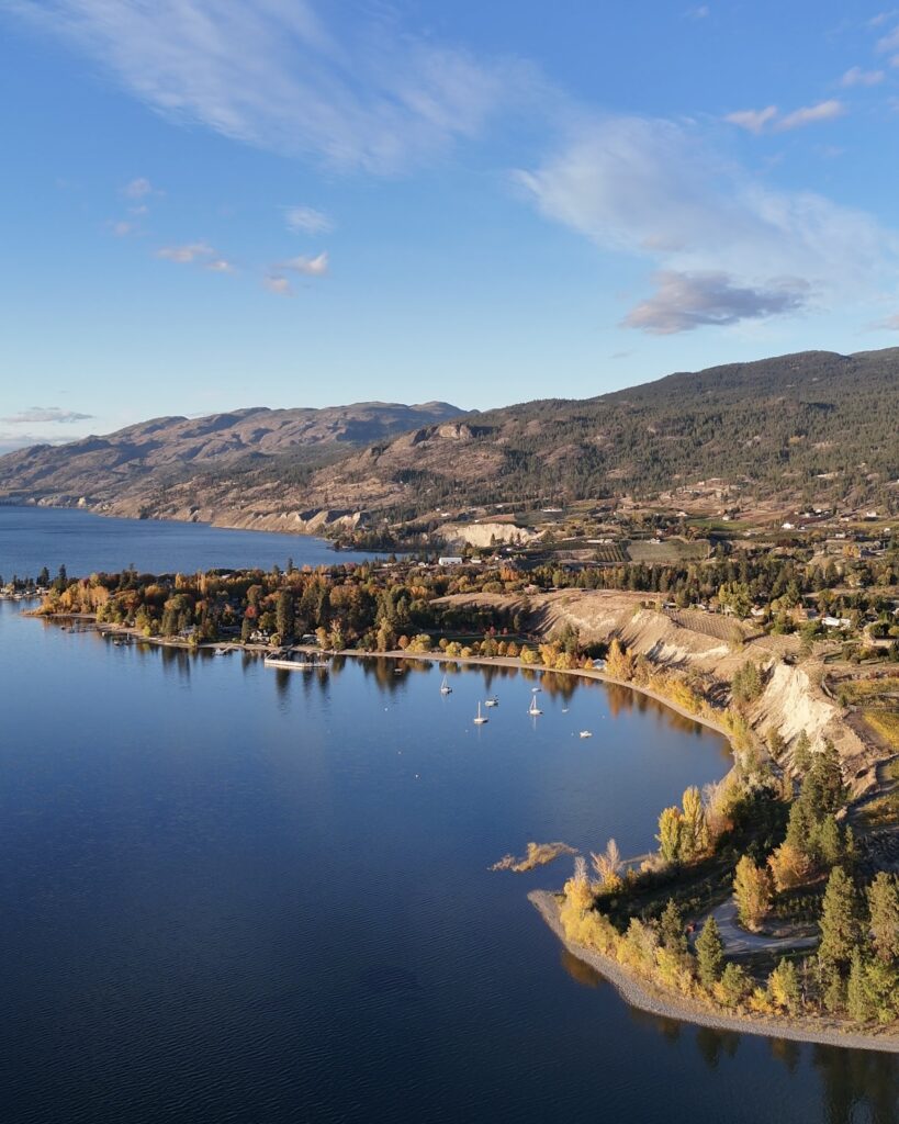 Okanagan lake from a birds eye view above Naramata British Columbia a a golden sunset covers the valley