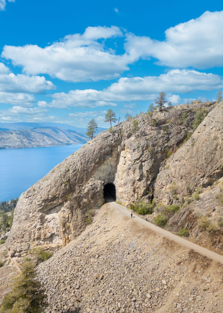 The Little Tunnel on the KVR Trail in Naramata British Columbia. Okanagan lake is in the background